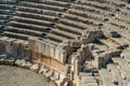 View of the arena and stands of the antique amphitheater in the ruins of Myra Demre, Turkey Royalty Free Stock Photo