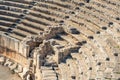 View of the arena and stands of the antique amphitheater in the ruins of Myra Demre, Turkey Royalty Free Stock Photo