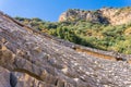 View from arena to the stepped stands of the rock-cut amphitheater in the ruins of Myra Demre, Turkey Royalty Free Stock Photo