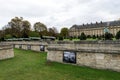 A view of the Army Museum at Les Invalides complex with historic cannons and landscaped garden, Paris Royalty Free Stock Photo