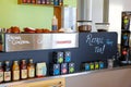 View of Aroha drinks and tea boxes on the front counter in a cafe