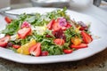 arugula salad, tropical fruit, plate