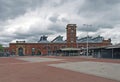 View of ashton open market with stalls and the historic market hall built in 1829