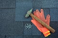 View on Asphalt Roofing Shingles Background. Roof Shingles - Roofing. Asphalt Roofing Shingles Hammer, Gloves and Nails Royalty Free Stock Photo