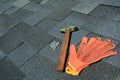 View on Asphalt Roofing Shingles Background. Roof Shingles - Roofing. Asphalt Roofing Shingles Hammer, Gloves and Nails Royalty Free Stock Photo