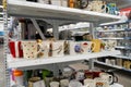 View of assorted coffee mugs displayed on store shelves. Royalty Free Stock Photo