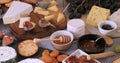 View of an assortment of cheese with figs and grapes