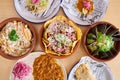 View of an assortment of delicious Mexican food on a wooden table.