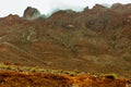 View of the Atlas Mountains in Morocco. Fog over high mountain peak Royalty Free Stock Photo