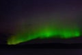 View of the aurora borealis. Polar lights in the night starry sky over the lake Royalty Free Stock Photo