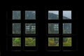 View of Austrian Woods in Tirol through Silhouetted Small Square Windows