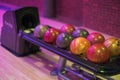 View of automated ball rack system in bowling center, ensuring smooth delivery of bowling balls. Royalty Free Stock Photo