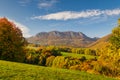 View of autumn landscape with rocky mountains in the background Royalty Free Stock Photo