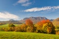 View of autumn landscape with rocky mountains in the background Royalty Free Stock Photo