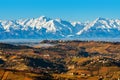 View of autumnal hills and snowy mountains in Italy. Royalty Free Stock Photo