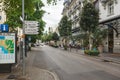 View of Avenue des Alpes in front of train station with city map and direction signs in Montreux, Switzerland