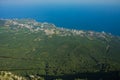 View from Ay petri mountain towards the crimean sea, with visible cable car lines leading to the lower station