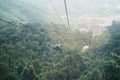 View of Ba Na Hills Mountain in the fog from Cable car. Landmark and popular. Da Nang, Vietnam and Southeast Asia travel concept Royalty Free Stock Photo