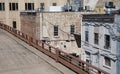 Back of old buildings in an alley way from an elevated level.