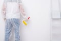 View from the back close-up of a worker gluing wallpaper on the walls Royalty Free Stock Photo