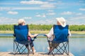 View from the back of a couple on chairs relaxes