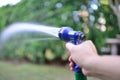 View from the back The hand of a man holding a spray of water Royalty Free Stock Photo