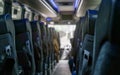 View from back seat at coach bus, more seats in blurred background Royalty Free Stock Photo