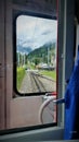 View From Train window along tracks to Mountain