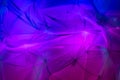 Backdrop of Flowing colorful fabric with light and shadows Royalty Free Stock Photo