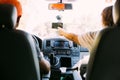 Couple inside car uses GPS navigator Royalty Free Stock Photo