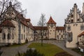 View of the backyard of the Hohes Scloss castle in Fussen on a cloudy winter day, with beautiful painting on facade, Allgaeu, Royalty Free Stock Photo