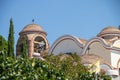 Iew on backyard of Monastery of Archangel Michael in Greece, Thasos Island, with vivid orange walls and roof,