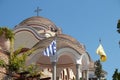 Iew on backyard of Monastery of Archangel Michael in Greece, Thasos Island, with vivid orange walls and roof,