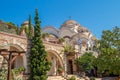 Iew on backyard of Monastery of Archangel Michael in Greece, Thasos Island, with vivid orange walls and roof,