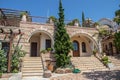 Iew on backyard of Monastery of Archangel Michael in Greece, Thasos Island, with vivid orange walls and roof,