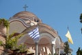 Iew on backyard of Monastery of Archangel Michael in Greece, Thasos Island, with vivid orange walls and roof,