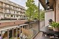 the view from the balcony of an apartment with tables