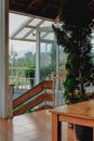 a view from the balcony of the tropical house with flowers and glass windows Royalty Free Stock Photo