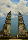 View of Bali volcano Mount Agung through the beautiful and majestic gate of the hindu Pura Lempuyan temple of Indonesia in Asia ho