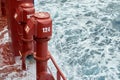 View of Ballast Water exchange process onboard of a ship using flow-through method underway in open ocean. Overflow method through