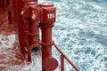 View of Ballast Water exchange process onboard of a ship using flow-through method underway in open ocean. Overflow method through