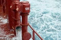 View of Ballast Water exchange process onboard of a ship using flow-through method underway in open ocean. Overflow method through