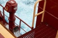 View of Ballast Water exchange process onboard of a ship using flow-through method underway in open ocean. Overflow method through