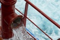 View of Ballast Water exchange process onboard of a ship using flow-through method underway in open ocean. Overflow method through