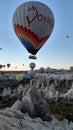 View of balloons flying over the valley of love, Cappadocia, Turkey