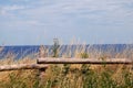 View of the Baltic Sea from the Polish beach, in the foreground a fence made of wooden piles Royalty Free Stock Photo