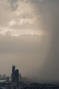 View of Bangkok with city skyscrapers covered in a dense smog before a rain