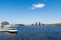 View of bank and River of Dnieper in Kiev, Ukraine, against blue sky with background bridge and cruise ship Royalty Free Stock Photo