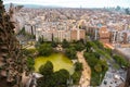 View of Barcelona city from above. Park with pond and trees and buildings