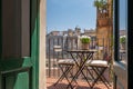 View of Barcelona through open wooden shutters from typical Spanish old house with beautiful balcony Royalty Free Stock Photo